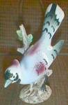Featured for you enjoyment is a wonderful Blue Jay porcelain figurine. He is marked with the clover in a wreath in black. Mark is by an unknown maker and associated with pre W.W.II or can be as early ...