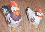 Very cute set of figurines. Marked in red Japan. Both are in excellent condition. Rooster stands 3<BR>1/2" tall while his mate is 2 1/2" tall.<BR>