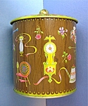 This decorative Tin Canister is Designed by Daher Long Island NY 11101 Container Made in England.  It is in very good condition and stands 6 inches tall with the lid.  