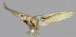 A bronze figure of a double headed eagle with spread wings. 2 1/2" high x 7" wide.