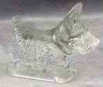 Sweet 3 7/8" long clear glass scottie candy container. Much detail. Very good condition.