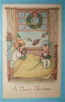 A Merry Christmas Postcard w/Two Children on Bed