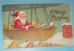 1907 A Merry Christmas Postcard with Santa In Balloon