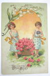 Click to view larger image of Two Girls Carrying A Big Basket Of Flowers Postcard (Image1)