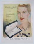 Click here to enlarge image and see more about item 11121: 1946 Richelieu Pearls with Woman Wearing Pearls 