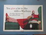 Click to view larger image of 1961 Marlboro Cigarettes with Man Sitting in Recliner  (Image1)