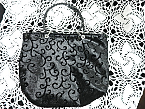 Black Handbag With Beaded Handles And Tassel Trim