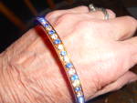 Click here to enlarge image and see more about item MB-JE727: Avon Bangle Bracelet Blue Clear Gold