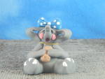 Click here to enlarge image and see more about item 00677: Cecile Elephant with Blue Bow 