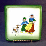 Click here to enlarge image and see more about item 12306: German Porcelain Trivet Hand Painted Dutch Children With Goat
