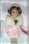 Vogue Doll Company's 8 inch, hard vinyl, Dinner at Eight Ginny Doll is from the 2001 limited edition Hat Shoppe Collection that celebrated 50 years of Ginny. She has dark blonde hair and blue moving eyes. This Ginny looks very grown up. Her ensemble includes a drop-waisted pink satin dress with a white imitation fur boa accented with a pink rose, a pink hat, white gloves, pearls and bracelet, hose, and pink cloth shoes. She is carrying a  pink purse. Retired doll is new and mint-in-the box with a certificate and doll-sized comb and brush. 