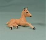Click here to enlarge image and see more about item h03174: Hagen-Renaker Miniature Lying Foal Palomino