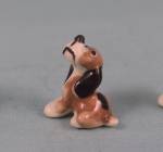 Click here to enlarge image and see more about item h03465: Hagen-Renaker Miniature Tiny Sitting Hound Puppy