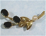Click here to enlarge image and see more about item j00612: Wells 14KGF Onyx and Pearl Flower Pin