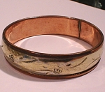 Click here to enlarge image and see more about item j01007: Unmarked Copper and Silver Bangle Bracelet