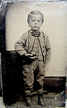 Tintype  Little boy holding apple or ball - C.1860s. (Image1)