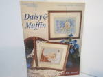 Click here to enlarge image and see more about item LA2024h: Leisure Arts Cross Stitch Daisy & Muffin  #2024