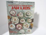 Click here to enlarge image and see more about item LA950k: Leisure Arts Just A Little Something Jar Lids  #950