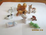 Click here to enlarge image and see more about item vfdog8c: Vintage Miniture Porcelain Varity Dog Set