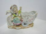 Click here to enlarge image and see more about item vpfigure14c: Vintage Porcelain Girl On Swan Cart Planter Figurine 