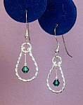 Click here to enlarge image and see more about item ERSW002E: Swarovski Emerald & Twisted SS earrings