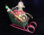 Click here to enlarge image and see more about item AAA496: Christmas Rattan Sleigh w/Assorted Ornaments