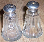 Click here to enlarge image and see more about item gw_99: Antique Cut Glass Shakers with Sterling Lids