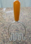 Click here to enlarge image and see more about item bakelitemasher040911: Butterscotch Bakelite Masher