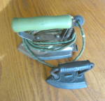 Click here to enlarge image and see more about item iron040710: Electric Vintage Iron and Sad Iron