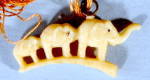 Click here to enlarge image and see more about item CMA29: Vintage Celluloid Family of Elephants Charm