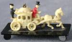 Click here to enlarge image and see more about item FVPEO104: Vintage Celluloid Stagecoach on Black Base