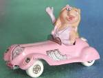 Click here to enlarge image and see more about item MTVS12: Vintage Miss Piggy sitting in her Pink Convertible