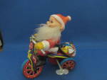 Click here to enlarge image and see more about item 8992AC: Santa on a Tricycle Toy