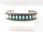 NATIVE AMERICAN STERLING SILVER AND TURQUOISE CUFF BRACELET SIGNED MJ