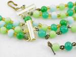 Click to view larger image of VINTAGE JADITE, BLUE, GREEN CARVED MOLDED GLASS BEAD 3 STRAND NECKLACE (Image2)