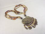 Click to view larger image of CHUNKY TRIBAL NECKLACE WITH LARGE SILVER PENDANT AND CARVED BEADS (Image3)