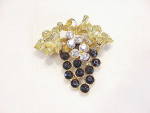 Click to view larger image of DARK PURPLE OR BLACK AND CLEAR RHINESTONE GRAPE BUNCH WITH IVY BROOCH (Image1)