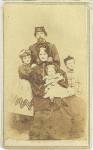 

<b>Union officer and family photographed in 1865 Nashville, Tennessee</b>

Wet plate, albumen carte de visite photograph, mounted to 2 3/8 x 4 card. Lovely family portrait featuring a Union artillery officer standing behind his pretty seated wife with his hands resting on her shoulders, while she holds a small child on her lap. Two older children flank their parents, a pretty young girl wearing a patterned dress is standing at the left, and a young boy wearing a cap and a military style jacket stands at the right. The officer sports a goatee beard while wearing a kepi with brass artillery hat insignia clearly visible. His frock coat has shoulders straps on it that appear to indicate that this officer holds the rank of colonel. Backmark: T.M. Schleier, Photographer, Cor. Union and Cherry Sts., and 27 Public Square, Nashville, Tennessee. There is an advertisement below his studio information; "Photographs of all size, in india ink, oil or water colors. Daguerreotypes and other pictures copied to any size. Landscapes, views, camps, &c. taken at short notice." There is a beautiful war date ink inscription on the reverse: "For Sister Maggie with the love of the Happy Family, Knoxville, Tenn., March 30th, 1865." Light age toning and wear with some corner damage, and spotting near the bottom of the view.  Very nice war date content taken in Tennessee of this Union artillery officer and his handsome family. Desirable pose.       